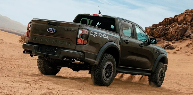 A forest green 2025 Ford Ranger off-roading.
