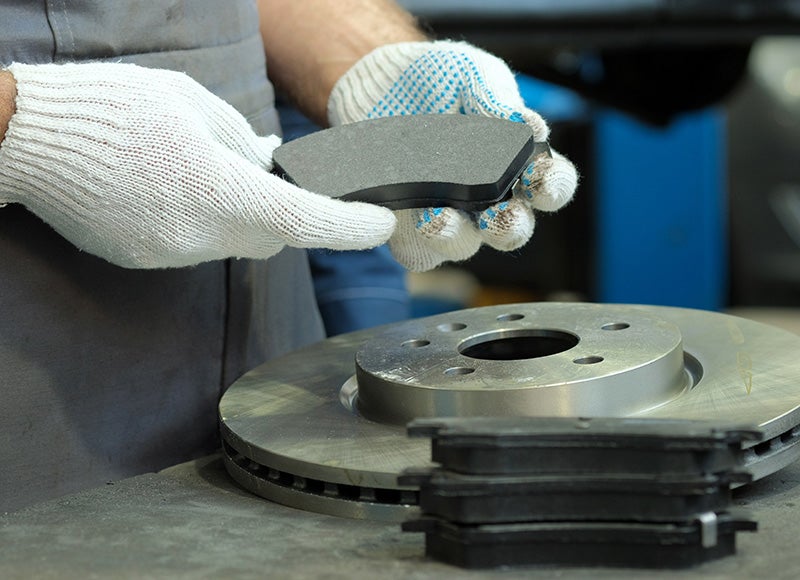 Person looking for Brake Pads in Hands